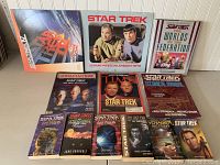 Front view of full collection with twelve Star Trek books, calendars and magazines