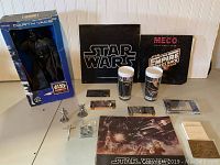 Full lot showing Darth Vader figure, program guides, cups, cards, pins, figurines, and record