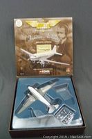Photo of the opened box with the DC-3 airplane and accessories in molded plastic insert showing overall presentation and contents.