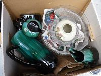 Box with two Blue Mountain Pottery bird figurines in blue-green glaze, clear glass bowl with floral ceramic insert, and another ceramic piece wrapped in newspaper.