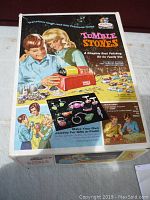 Front of original box with colorful vintage illustrations and product information.