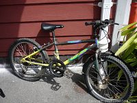 Full side image of vintage Norco mountain bike showing frame, tires, pedals and seat.