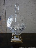 Full view of the decorative crystal candy or mint holder with lid and gold-tone claw foot stone base, showing approximate height and design.