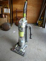 Full upright view of the vintage Windtunnel Technology vacuum cleaner showing overall condition and components.