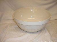 Front view of white ceramic mixing bowl showing overall shape and size