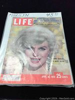 Full front cover of the 1959 Life Magazine featuring Marilyn Monroe, price 25 cents, with headline 'A Comic Marilyn Sets Movie Aglow'.