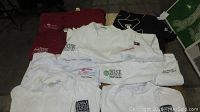 Full selection of chef jackets laid out showing color and quantity