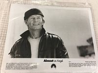Black-and-white 8x10 promotional photo featuring Paul Hogan smiling in a jacket and hat, with movie title and copyright information visible.