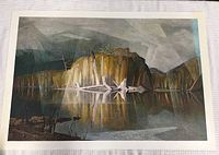 Full view of one print showing rocky cliff, trees, water with reflection, unframed, on white cloth background