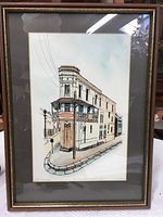 Full front view of framed artwork depicting the Stereograph Building, showing frame and matting detail.