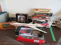 Overview of boxed metal and die-cast models and doll