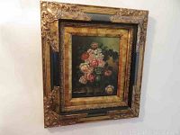 Ornate gold and black multi-layered frame holding floral print by Von Bringen, 18x16 size.