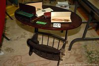 Five pen and pencil sets displayed on oval wooden table; Cross set gold filled case visible.