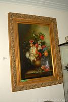 Full view of large framed botanical oil painting hung on wall