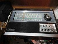 Marc double conversion receiver showing rectangular tuning display, control knobs on lower right, and volume tuner dial on upper right.