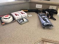 Photo of hair styling tools and some security devices on a kitchen countertop