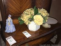Lot items on wooden sideboard: Lenox cake plate, Limoges vase with faux flowers, unbranded figurine