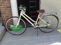 Side view of white Schwinn Gateway hybrid bicycle showing frame, seat, handlebars, rear rack, and tires.