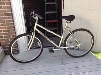 Full left side view of the Diamondback Outlook DX 18 inch bicycle showing silver frame, black tires, and black seat.
