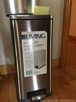 Photo of rectangular metal step bin with label showing 15L capacity, foot pedal, and lid