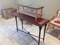Overall view of Bombay wooden hall table with boot tray table placed on top showing tile ceramic top