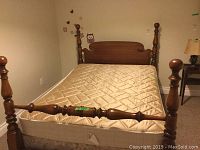 Full view of vintage walnut 4-poster double bed with mattress installed.