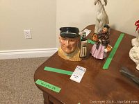 Front view of the male Golfer Toby mug figurine showing detailed face and cap.