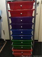 Front view of the colorful 10-drawer organizer showing red, purple, blue, green, and red drawers in a chrome frame.