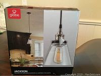 Box front showing Globe brand pendant light model Jackson in a kitchen setting.