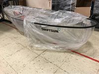 Side view of transparent kayak hull with Driftsun logo and black frame