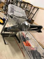 Full view of treadmill frame wrapped in plastic showing entire unit