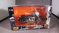 Front view of the boxed Maisto Harley Davidson Road King model, showing clear window with visible motorcycle and box graphics.