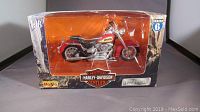 Front view of Maisto Series 6 Harley Davidson Heritage Softail model motorcycle in original box with clear display window.