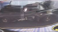 Close-up photo of the black Batmobile model inside its original box showing detailed car design.
