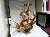 Front view of the vintage Spanish Caravel ship lamp showing copper sails, brass base, and power cord.