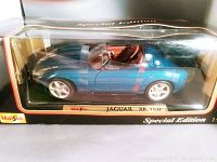 Maisto Jaguar XK 180 model car in unopened packaging showing left side view
