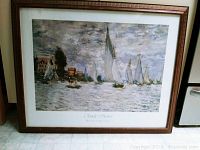 Full view of the framed Claude Monet print depicting sailboats on water with a wooden frame.
