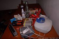 Overview of entire lot showing amplifiers, dryer, vaporizer, Apple SuperDrive and miscellaneous items