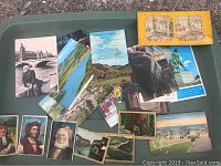 Overview of various postcards, tobacco cards including small photographic cards and a vintage stereoscope card.
