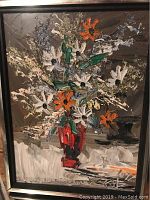 Full view of the floral painting showing textured oil paint flowers in a vase, framed.