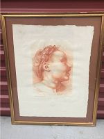 Framed red chalk style print of a male profile portrait after Andrea del Sarto with light brown matting and gold frame.