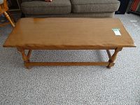 Top-down view showing the smooth rectangular tabletop with light maple wood grain and no visible scratches.