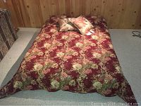 Full view of queen size bed set with floral comforter, shams, and decorative pillows on bed.