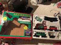 The original Santa's Express box with cutout window showing the train set packaging inside.