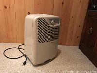 Three-quarter side view showing overall condition and power cord.