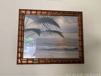 Front view of the smaller seaside art print in a bamboo style frame, dimensions approx. 27x33 inches