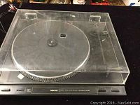 Turntable with dust cover on, showing general top view.