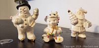 Photo of three Lenox holiday figurines including snowman, teddy bear, and Santa marking the year 2003.