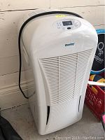 Full front view of the white Danby dehumidifier showing the vent and general shape.