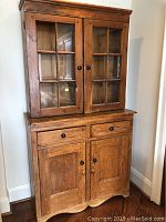 Front view of assembled two-piece pine cupboard